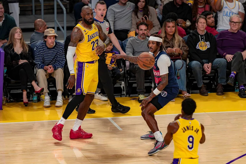 Los Angeles Lakers forward LeBron James (23) passing the ball to his son, Bronny James Jr. (9) during an NBA basketball game against the Washington Wizards on March 30th, 2026 in Los Angeles, CA.