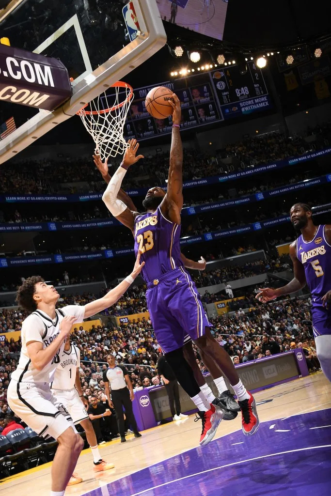 LeBron James of the Los Angeles Lakers drives to the basket during the game against the Brooklyn Nets on March 27, 2026 at Crypto.Com Arena in Los Angeles, California. (Photo by Adam Pantozzi/NBAE via Getty Images) NBAE via Getty Images