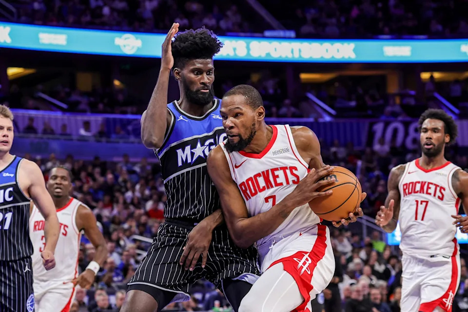 Feb 26, 2026; Orlando, Florida, USA; Houston Rockets forward Kevin Durant (7) is fouled by Orlando Magic forward Jonathan Isaac (1) during the second half at Kia Center. Mandatory Credit: Mike Watters-Imagn Images