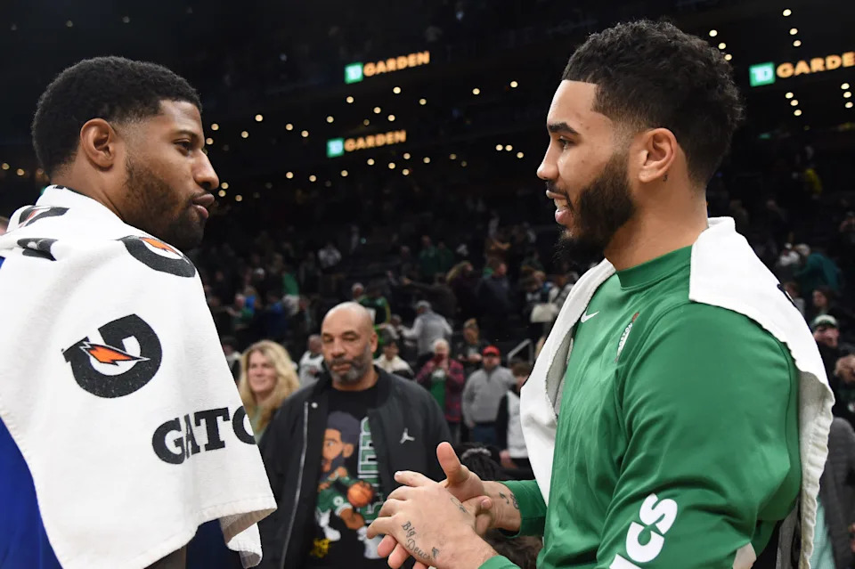 Jan 27, 2024; Boston, Massachusetts, USA; LA Clippers forward Paul George (13) and Boston Celtics forward Jayson Tatum (0) after the game at TD Garden. Mandatory Credit: Bob DeChiara-USA TODAY Sports