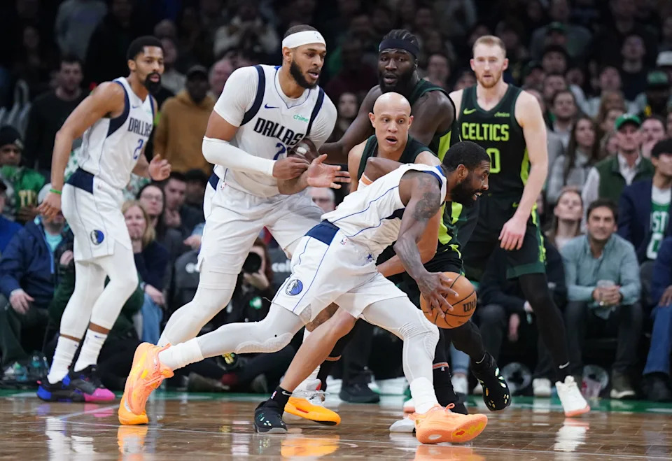 Feb 6, 2025; Boston, Massachusetts, USA; Dallas Mavericks guard Kyrie Irving (11) drives the ball against Boston Celtics guard Jordan Walsh (27) in the second half at TD Garden. Mandatory Credit: David Butler II-Imagn Images