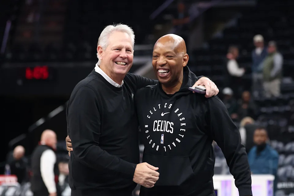 Mar 21, 2025; Salt Lake City, Utah, USA; Utah Jazz CEO Danny Ainge and Boston Celtics assistant coach Sam Cassell greet before the game at Delta Center. Mandatory Credit: Rob Gray-Imagn Images