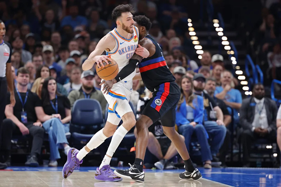 Mar 30, 2026; Oklahoma City, Oklahoma, USA; Oklahoma City Thunder center Chet Holmgren (7) drives as Detroit Pistons forward Paul Reed (7) defends during the first half at Paycom Center. Mandatory Credit: Alonzo Adams-Imagn Images