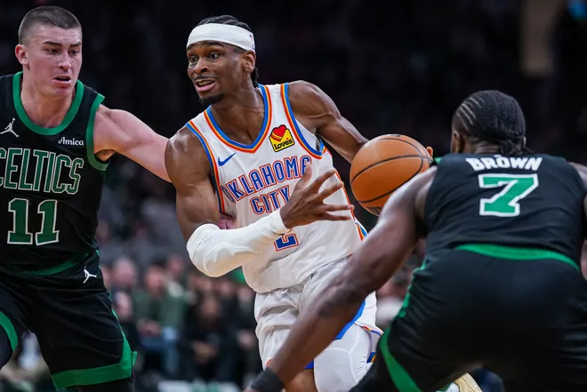 Mar 12, 2025; Boston, Massachusetts, USA; Oklahoma City Thunder guard Shai Gilgeous-Alexander (2) drives the ball against Boston Celtics guard Payton Pritchard (11) and guard Jaylen Brown (7) in the third quarter at TD Garden. Mandatory Credit: David Butler II-Imagn Images