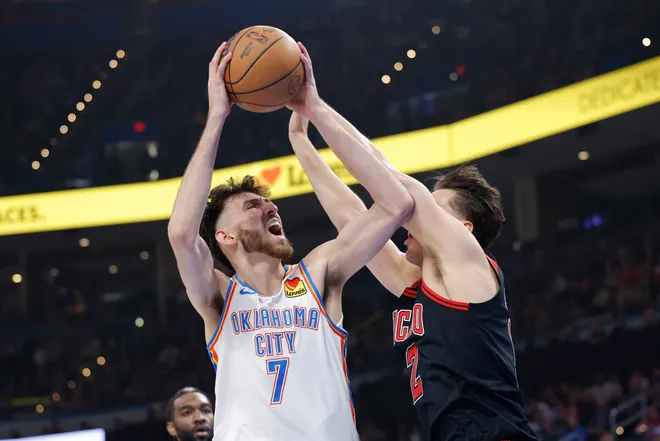 Mar 31, 2025; Oklahoma City, Oklahoma, USA; Oklahoma City Thunder forward Chet Holmgren (7) goes up for a basket as Chicago Bulls forward Zach Collins (12) defends during the second quarter at Paycom Center. Mandatory Credit: Alonzo Adams-Imagn Images