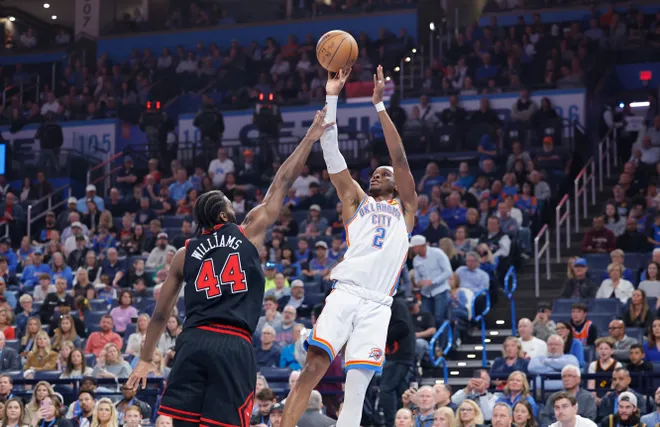 Mar 31, 2025; Oklahoma City, Oklahoma, USA; Oklahoma City Thunder guard Shai Gilgeous-Alexander (2) shoots a three point basket over Chicago Bulls forward Patrick Williams (44) during the first quarter at Paycom Center. Mandatory Credit: Alonzo Adams-Imagn Images