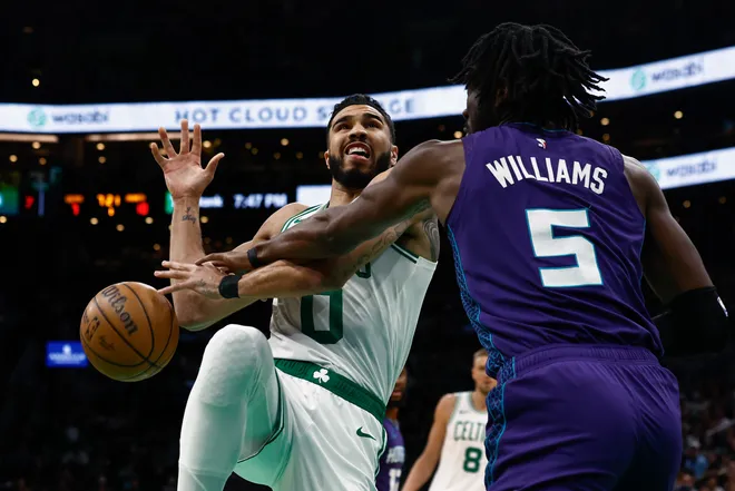 BOSTON, MA - APRIL 11: Mark Williams #5 of the Charlotte Hornets knocks the ball away from Jayson Tatum #0 of the Boston Celtics during the first quarter at TD Garden on April 11, 2025 in Boston, Massachusetts. NOTE TO USER: User expressly acknowledges and agrees that, by downloading and/or using this Photograph, user is consenting to the terms and conditions of the Getty Images License Agreement. (Photo By Winslow Townson/Getty Images)