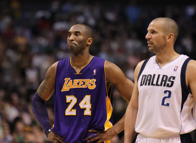 Los Angeles Lakers guard Kobe Bryant talks with Dallas Mavericks guard Jason Kidd.