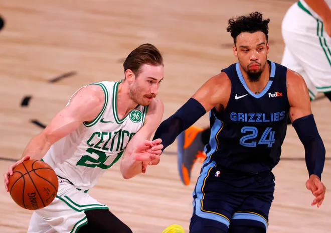 Aug 11, 2020; Lake Buena Vista, Florida, USA; Gordon Hayward #20 of the Boston Celtics drives the ball as Dillon Brooks #24 of the Memphis Grizzlies defends during the fourth quarter at The Arena at ESPN Wide World Of Sports Complex on August 11, 2020 in Lake Buena Vista, Florida. Mandatory Credit: Mike Ehrmann/Pool Photo-USA TODAY Sports