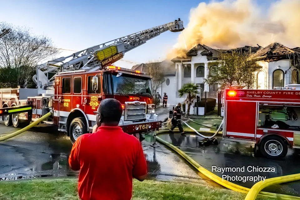 Crews with the Shelby County Fire Department and Memphis Fire Department battle a house fire near TPC Southwind on Thursday, March 26, 2026. The home was once owned by Memphis basketball star Lorenzen Wright.