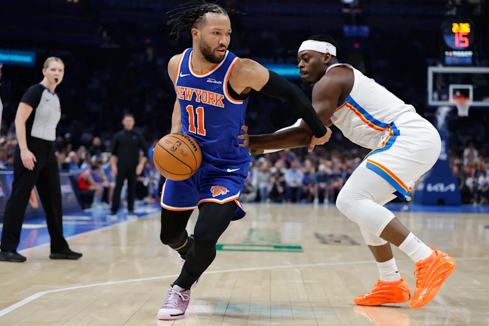 Mar 29, 2026; Oklahoma City, Oklahoma, USA; New York Knicks guard Jalen Brunson (11) drives around Oklahoma City Thunder guard Luguentz Dort (5) during the first half at Paycom Center. Mandatory Credit: Alonzo Adams-Imagn Images
