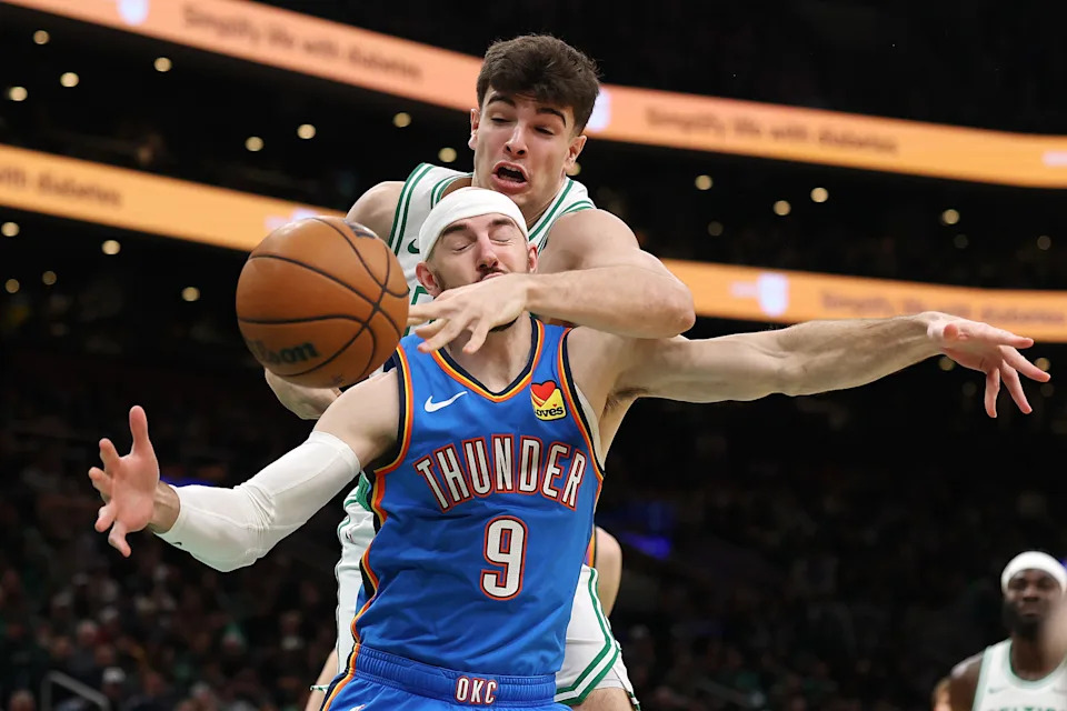 BOSTON, MASSACHUSETTS - MARCH 25: Hugo Gonzalez #28 of the Boston Celtics and Alex Caruso #9 of the Oklahoma City Thunder battle for a loose ball during the first quarter at TD Garden on March 25, 2026 in Boston, Massachusetts. NOTE TO USER: User expressly acknowledges and agrees that, by downloading and/or using this Photograph, user is consenting to the terms and conditions of the Getty Images License Agreement. (Photo by Maddie Meyer/Getty Images)