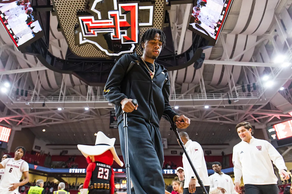LUBBOCK, TEXAS - MARCH 03: JT Toppin of the Texas Tech Red Raiders walks across the court with the help of crutches after the game against the TCU Horned Frogs at United Supermarkets Arena on March 03, 2026 in Lubbock, Texas. (Photo by John E. Moore III/Getty Images)