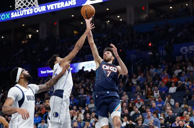 Dec 5, 2025; Oklahoma City, Oklahoma, USA; Oklahoma City Thunder center Chet Holmgren (7) shoots as Dallas Mavericks guard Max Christie (00) defends during the second half at Paycom Center. Mandatory Credit: Alonzo Adams-Imagn Images