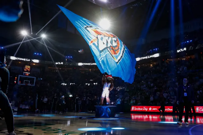 Dec 25, 2025; Oklahoma City, Oklahoma, USA; Oklahoma City Thunder mascot, Rumble the Bison, waves a giant team flag during team introductions before a game against the San Antonio Spurs at Paycom Center. Mandatory Credit: Alonzo Adams-Imagn Images