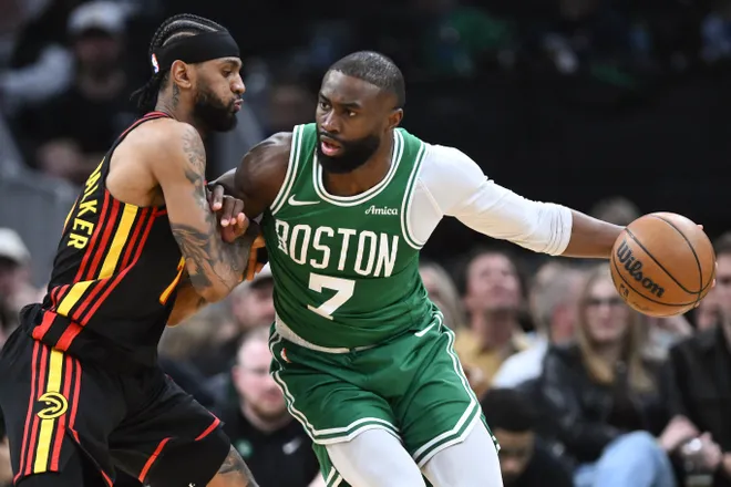 Jan 28, 2026; Boston, Massachusetts, USA; Boston Celtics guard Jaylen Brown (7) drives to the basket against Atlanta Hawks guard Nickeil Alexander-Walker (7) during the first half at the TD Garden. Mandatory Credit: Brian Fluharty-Imagn Images