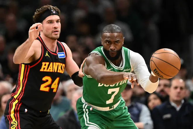 Jan 28, 2026; Boston, Massachusetts, USA; Boston Celtics guard Jaylen Brown (7) passes the ball in front of Atlanta Hawks forward Corey Kispert (24) during the first half at the TD Garden. Mandatory Credit: Brian Fluharty-Imagn Images