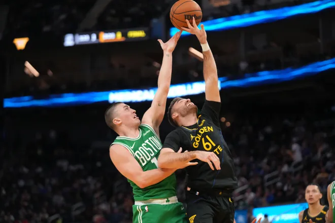 Jan 20, 2025; San Francisco, California, USA; Boston Celtics guard Payton Pritchard (11) and Golden State Warriors guard Pat Spencer (61) battle for control of a rebound in the fourth quarter at the Chase Center. Mandatory Credit: Cary Edmondson-Imagn Images
