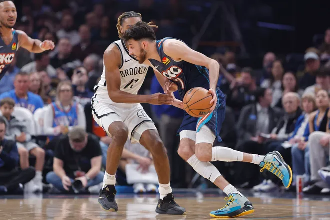 Feb 20, 2026; Oklahoma City, Oklahoma, USA; Oklahoma City Thunder center/forward Chet Holmgren (7) drives past Brooklyn Nets forward/center Noah Clowney (21) during the first half at Paycom Center. Mandatory Credit: Alonzo Adams-Imagn Images