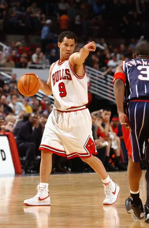 CHICAGO - JANUARY 26: Rick Brunson #9 of the Chicago Bulls points while being defended by Steve Francis #3 of the Houston Rockets during the game at United Center on January 26, 2003 in Chicago, Illinois. The Bulls won 100-98. NOTE TO USER: User expressly acknowledges and agrees that, by downloading and/or using this Photograph, User is consenting to the terms and conditions of the Getty Images License Agreement. (Photo by Jonathan Daniel/Getty Images)