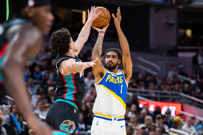 Mar 1, 2026; Indianapolis, Indiana, USA; Indiana Pacers forward Obi Toppin (1) shoots the ball while Memphis Grizzlies guard Scotty Pippen Jr. (1) defends in the first half at Gainbridge Fieldhouse. Mandatory Credit: Trevor Ruszkowski-Imagn Images