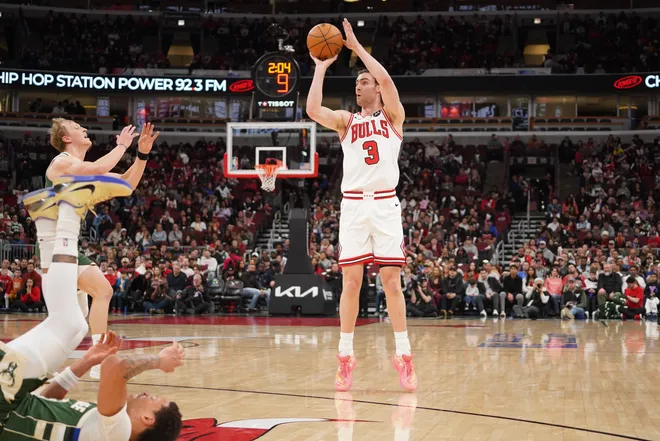 Mar 1, 2026; Chicago, Illinois, USA; Chicago Bulls guard Josh Giddey (3) makes a three point basket against the Milwaukee Bucks during the first half at United Center. Mandatory Credit: David Banks-Imagn Images