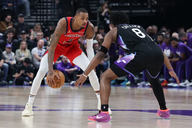 Feb 26, 2026; Salt Lake City, Utah, USA; New Orleans Pelicans guard Dejounte Murray (5) looks for the play against Utah Jazz guard Isaiah Collier (8) during the first half at Delta Center. Mandatory Credit: Rob Gray-Imagn Images