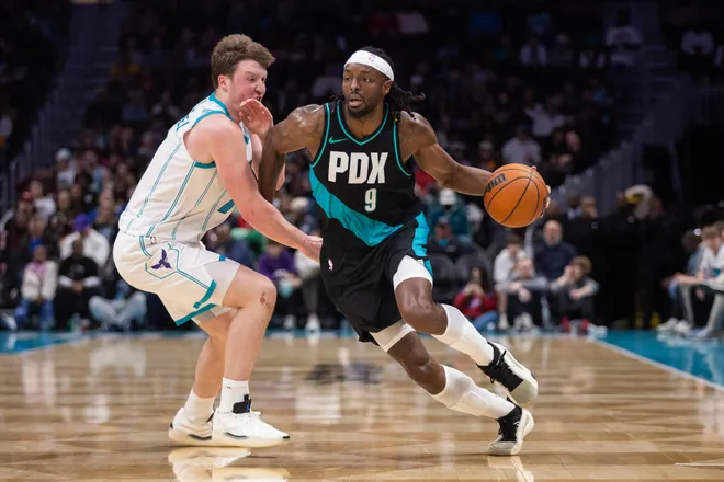 Feb 28, 2026; Charlotte, North Carolina, USA; Portland Trail Blazers forward Jerami Grant (9) drives past Charlotte Hornets guard Kon Knueppel (7) during the second half at Spectrum Center. Mandatory Credit: Scott Kinser-Imagn Images