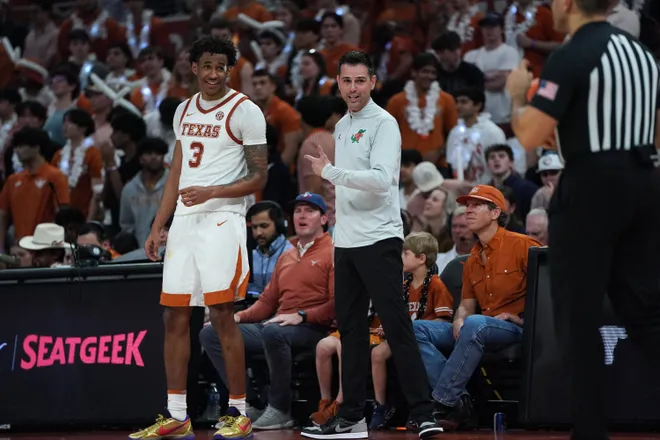 Feb 25, 2026; Austin, Texas, USA; Florida Gators head coach Todd Golden jokes with Texas Longhorns guard Dailyn Swain (3) during the second half at Moody Center. Mandatory Credit: Dustin Safranek-Imagn Images