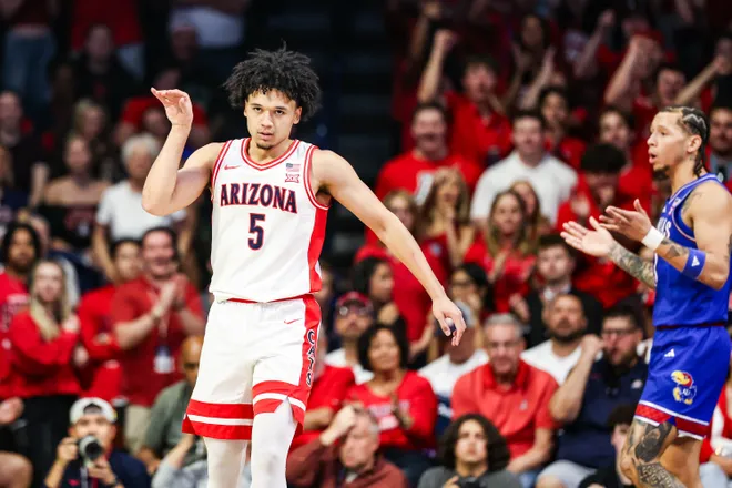 Feb 28, 2026; Tucson, Arizona, USA; Arizona Wildcats guard Brayden Burries (5) celebrates during the first half of the game against the Kansas Jayhawks at McKale Memorial Center. Mandatory Credit: Aryanna Frank-Imagn Images