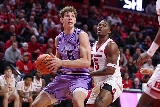 Feb 24, 2026; Piscataway, New Jersey, USA; Washington Huskies forward Hannes Steinbach (6) looks to the basket as Rutgers Scarlet Knights guard Darren Buchanan Jr. (5) defends during the first half at Jersey Mike's Arena. Mandatory Credit: Vincent Carchietta-Imagn Images