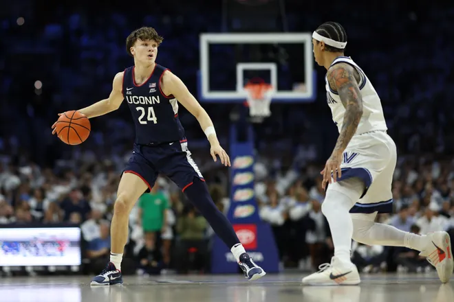 Feb 21, 2026; Philadelphia, Pennsylvania, USA; UConn Huskies guard Braylon Mullins (24) dribbles the ball against the Villanova Wildcats during the first half at Xfinity Mobile Arena. Mandatory Credit: Bill Streicher-Imagn Images