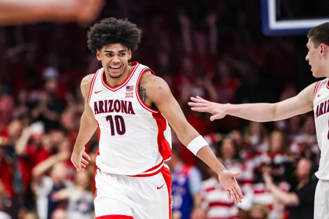 Feb 28, 2026; Tucson, Arizona, USA; Arizona Wildcats forward Koa Peat (10) celebrates during the first half of the game against the Kansas Jayhawks at McKale Memorial Center. Mandatory Credit: Aryanna Frank-Imagn Images