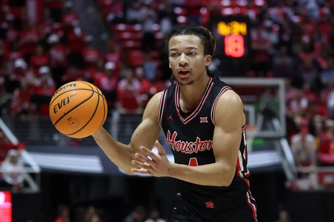 Feb 10, 2026; Salt Lake City, Utah, USA; Houston Cougars guard Kingston Flemings (4) looks to pass against the Utah Utes during the first half at Jon M. Huntsman Center. Mandatory Credit: Rob Gray-Imagn Images