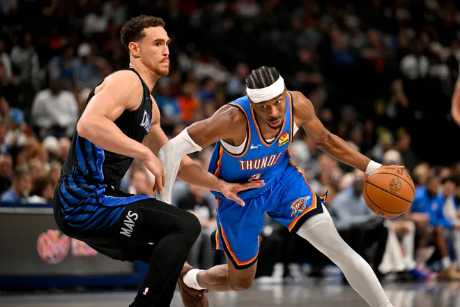 Mar 1, 2026; Dallas, Texas, USA; Oklahoma City Thunder guard Shai Gilgeous-Alexander (2) drives to the basket past Dallas Mavericks forward Dwight Powell (7) during the second half at the American Airlines Center. Mandatory Credit: Jerome Miron-Imagn Images