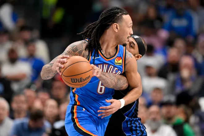 Mar 1, 2026; Dallas, Texas, USA; Oklahoma City Thunder forward Jaylin Williams (6) looks to move the ball past Dallas Mavericks forward Daniel Gafford (21) during the second quarter at the American Airlines Center. Mandatory Credit: Jerome Miron-Imagn Images