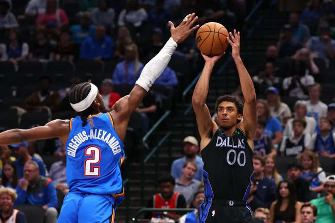 DALLAS, TEXAS - MARCH 01: Max Christie #00 of the Dallas Mavericks shoots against Shai Gilgeous-Alexander #2 of the Oklahoma City Thunder during the fourth quarter at American Airlines Center on March 01, 2026 in Dallas, Texas. NOTE TO USER: User expressly acknowledges and agrees that, by downloading and or using this photograph, user is consenting to the terms and conditions of the Getty Images License Agreement. (Photo by Sam Hodde/Getty Images)