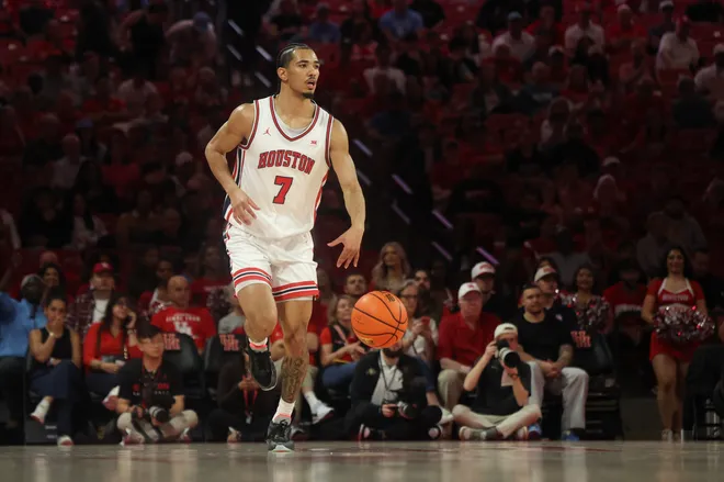 Feb 28, 2026; Houston, Texas, USA; Houston Cougars guard Milos Uzan (7) dribbles against the Colorado Buffaloes in the first half at Fertitta Center. Mandatory Credit: Thomas Shea-Imagn Images