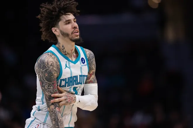 Feb 28, 2026; Charlotte, North Carolina, USA; Charlotte Hornets guard LaMelo Ball (1) celebrates a three point basket against the Portland Trail Blazers during the second half at Spectrum Center.