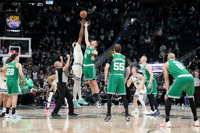 Mar 2, 2026; Milwaukee, Wisconsin, USA; Tip off between Milwaukee Bucks center Myles Turner (3) and Boston Celtics center Nikola Vucevic (4) in the first half at Fiserv Forum. Mandatory Credit: Michael McLoone-Imagn Images