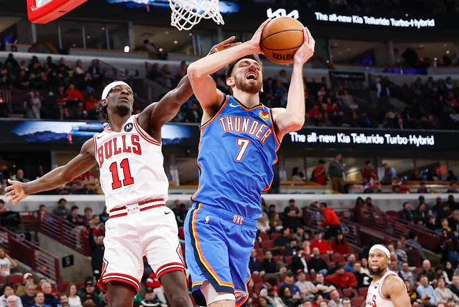 Mar 3, 2026; Chicago, Illinois, USA; Chicago Bulls forward Leonard Miller (11) defends against Oklahoma City Thunder center Chet Holmgren (7) during the second half at United Center. Mandatory Credit: Kamil Krzaczynski-Imagn Images