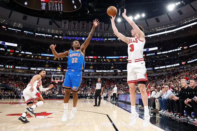 Mar 3, 2026; Chicago, Illinois, USA; Chicago Bulls guard Josh Giddey (3) shoots against Oklahoma City Thunder guard Cason Wallace (22) during the first half at United Center. Mandatory Credit: Kamil Krzaczynski-Imagn Images