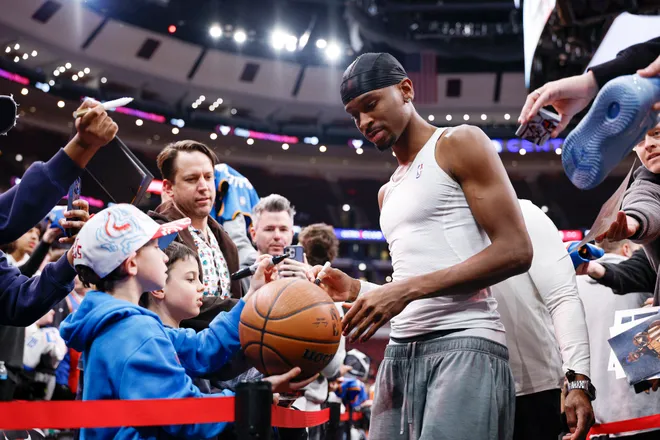 Mar 3, 2026; Chicago, Illinois, USA; Oklahoma City Thunder guard Shai Gilgeous-Alexander (2) signs autographs before an NBA game against the Chicago Bulls at United Center. Mandatory Credit: Kamil Krzaczynski-Imagn Images