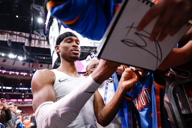 Mar 3, 2026; Chicago, Illinois, USA; Oklahoma City Thunder guard Shai Gilgeous-Alexander (2) signs autographs before an NBA game against the Chicago Bulls at United Center. Mandatory Credit: Kamil Krzaczynski-Imagn Images