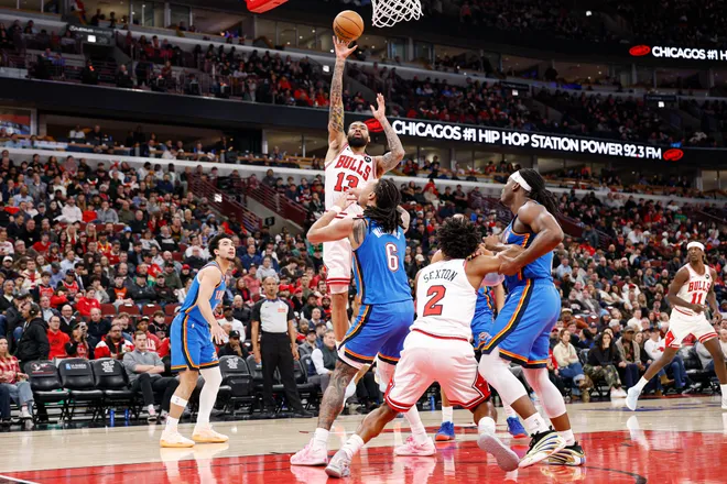 Mar 3, 2026; Chicago, Illinois, USA; Chicago Bulls center Nick Richards (13) shoots against Oklahoma City Thunder forward Jaylin Williams (6) during the first half at United Center. Mandatory Credit: Kamil Krzaczynski-Imagn Images