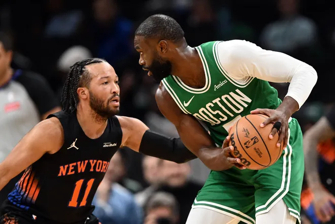 New York Knicks guard Jalen Brunson (11) defends Boston Celtics guard Jaylen Brown (7) during the first half at the TD Garden.