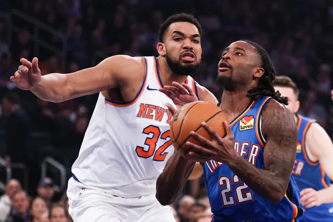 Mar 4, 2026; New York, New York, USA; Oklahoma City Thunder guard Cason Wallace (22) goes to the basket against New York Knicks center Karl-Anthony Towns (32) during the first half at Madison Square Garden. Mandatory Credit: Vincent Carchietta-Imagn Images