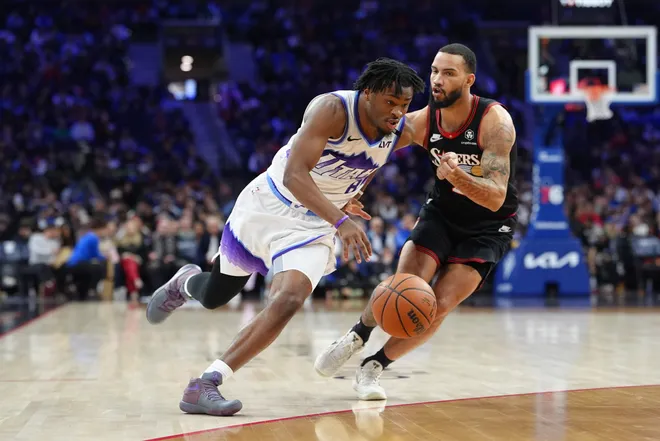 Mar 4, 2026; Philadelphia, Pennsylvania, USA; Utah Jazz guard Isaiah Collier (8) drives against Philadelphia 76ers guard Tyrese Martin (23) in the third quarter at Xfinity Mobile Arena. Mandatory Credit: Kyle Ross-Imagn Images