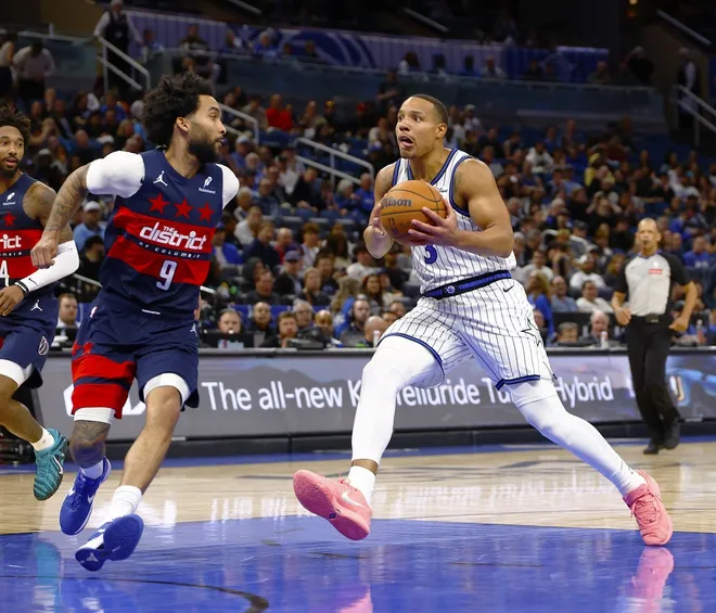 Mar 3, 2026; Orlando, Florida, USA; Orlando Magic guard Desmond Bane (3) drives to the basket as Washington Wizards forward Justin Champagnie (9) defends in the second half at Kia Center.