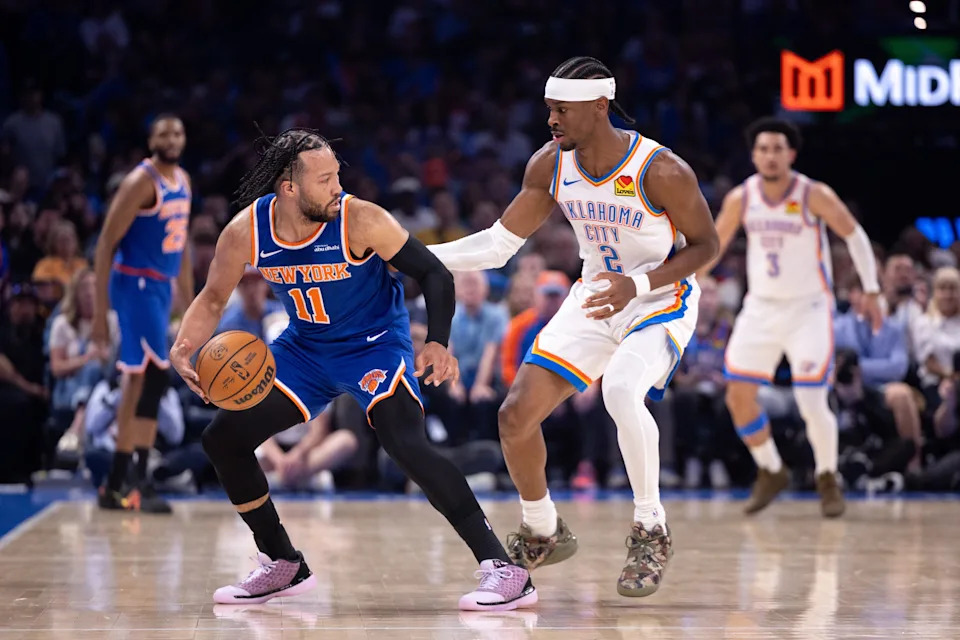 OKLAHOMA CITY, OKLAHOMA - MARCH 29: Jalen Brunson #11 of the New York Knicks protects the ball from Shai Gilgeous-Alexander #2 of the Oklahoma City Thunder during the first half at Paycom Center on March 29, 2026 in Oklahoma City, Oklahoma. NOTE TO USER: User expressly acknowledges and agrees that, by downloading and or using this photograph, User is consenting to the terms and conditions of the Getty Images License Agreement. (Photo by William Purnell/Getty Images)